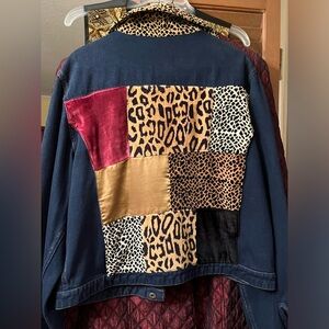 Denim Jacket with patchwork design on the back.